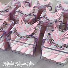 some pink and white boxes with butterflies on them