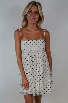 Unleash your inner fashionista with our Vera Dot Mini Dress! This playful and sheer dress features delicate tie shoulder straps and a fun polka dot pattern. Perfect for any occasion, this dress will have you feeling stylish and confident. (Warning: may induce envy in others.) Size + Fit Riley is 5’7” and wearing a size Small Content + Care 100% Polyester Lining: 100% Cotton Hand Wash Cold Color Separate Black And White Polka Dot Dress, Uga Outfits, Polka Dot Mini Dress, Matching Sets Outfit, Crop Top Sweater, Little White Dresses, Active Wear Outfits, Polka Dot Pattern