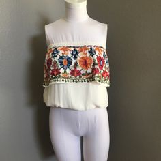 Embroidered Crop Top Fitted Embellished Embroidered Top For Summer, Vacation Multicolor Embroidered Top With Hem Detail, Multicolor Embroidered Top With Hem For Vacation, Summer Multicolor Embroidered Top With Embroidered Hem, Summer Embellished Embroidered Top, Summer Embroidered Top With Floral Print, Spring Embroidered Top With Geometric Multicolor Embroidery, Multicolor Embroidered Floral Top For Summer, Multicolor Embroidered Floral Print Top For Summer