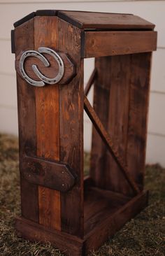 an old wooden chair with a metal ring on it's seat and the letter c