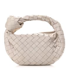 This is an authentic BOTTEGA VENETA Nappa Intrecciato Mini Jodie in Chalk. This bag is crafted of soft woven lambskin leather in white. The bag features a matching handle and a polished gold top zipper that opens to a matching white leather interior. White Top Handle Bag With Intrecciato Weave, Cream Woven Leather Bag, Designer White Bags With Intrecciato Weave, Luxury White Shoulder Bag With Intrecciato Weave, Luxury Cream Shoulder Bag With Woven Leather, Luxury Cream Woven Leather Shoulder Bag, Beige Leather Bags With Interwoven Design, Luxury White Intrecciato Weave Shoulder Bag, Luxury Cream Shoulder Bag With Intrecciato Weave