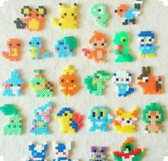 an assortment of pixelated pokemons on a white surface with the letters e and f