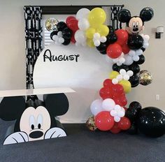 mickey mouse balloon arch at an office party