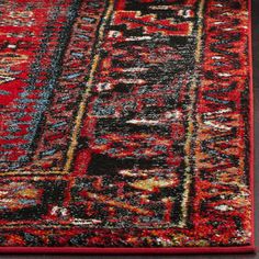 a red and black area rug on the floor