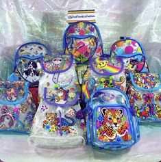 a group of children's backpacks and lunch bags with animal designs on them