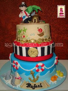 a three tiered cake with an image of a pirate on top