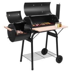 an outdoor bbq grill with wheels and trays for cooking food on the side