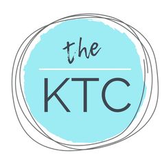 the ktc logo on a blue circle with black and white lettering that reads, the ktc