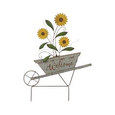 a metal wheelbarrow with sunflowers in it and the word welcome on top