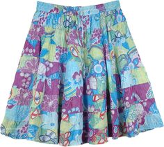 Tiered Floral Blue Cotton Skirt - A summer paradise blooms on this 8 tiered flowing, bouncy, flouncy unique one-of-a-kind style in short skirts. A feminine beauty an absolutely awesome cheerful color scheme in purple and blue. The horizontal patchwork pattern looks great on this short length skirt with a lot of fabric to go around, 8 wonderful vibrant tiers. It features an elastic waist with a flexible drawstring. This chic skirt can be dressed up or down with flat shoes or high heels and you ca Tiered Floral Print Beach Skirt, Multicolor Tiered Skirt With Floral Print, Multicolor Tiered Bottoms For Spring, Purple Flared Mini Skirt For Summer, Bohemian Blue Tiered Bottoms, Blue Bohemian Tiered Bottoms, Casual Green Tiered Skirt, Blue Tiered Bottoms For Vacation, Green Tiered Beach Skirt