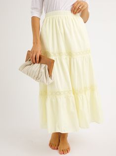 A refined take on a bohemian classic. A charming tiered skirt with pale yellow lace and elastic waist create a feminine feel for summer. Fit: Runs True To Size Fabric Content: 100% CottonFabric Care: Machine Wash Cold Gentle Cycle, lay flat to dryMeasurements: 34" LongLining: Yes, 100% PolyesterZipper: No S:0-2 M:4-6 L:8-10 Summer Lace Tiered Maxi Skirt, Summer Lace Maxi Skirt With Ruffled Detail, Lace Ruffled Maxi Skirt For Summer, Feminine Tiered Maxi Skirt For Summer, Summer Lace Maxi Skirt With Ruffles, Flowy Tiered Lace Skirt, Chic Lace Trim Maxi Skirt For Summer, Summer Lace Tiered Bottoms, Tiered Lace Bottoms For Summer