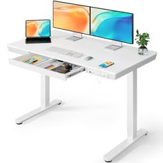 two computer monitors sitting on top of a white desk