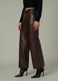 Slim fit through the waist and hips with a high rise and a wide leg that hits right above the ankle. DETAILS + FIT High Rise: 11.5” Wide Leg Zip fly Trouser-pocket styling Leg opening: 23" Ankle length: 28” inseam Soft vegan leather with added stretch for comfort. 100% Vegan leather with polyester backing Hand wash Turn the jeans inside out to protect the fabric from abrasion. Lay them flat in the sink or bathtub and rinse thoroughly with cold water to remove all suds. Spot clean when needed wit Fabric Pants, Shirt Jacket Men, Trouser Pocket, Crop Top Sweater, Coffee Bean, Crop Top Blouse, Romper Dress, Fall Shopping, Maternity Tops