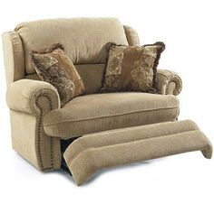 a beige chair with pillows on it