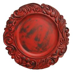 a red plate with an ornate design on it