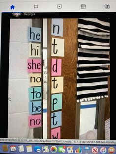 a door with some cut out letters on the front and back sides, hanging from it's side