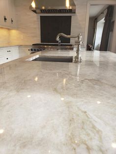 a kitchen counter top with an oven in the background