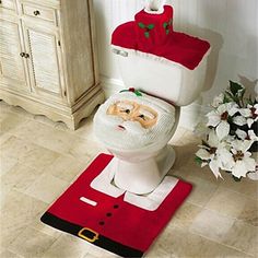 a white toilet sitting in a bathroom next to a christmas decoration on top of it