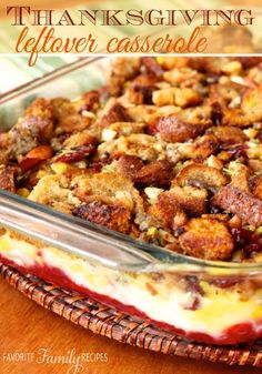 thanksgiving leftover casserole with cranberry sauce in a glass dish on a wooden table