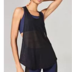 Two In One Expand Your Sportswear Repertoire With This Double Layer Mesh Vest. In A Quick-Drying Black Linear Mesh, This Drop Armhole Racer Vest Features A Detachable Medium Support Bra In Navy Blue, Finished With A Keyhole Back Detailing And Reflective Ivy Park Logo. By Ivy Park. 86% Polyamide, 14% Elastane. Machine Wash. Chic Black Top With Mesh Back, Chic Black Tops With Mesh Back, Chic Black Tank Top For Workout, Chic Black Workout Tank Top, Black Summer Yoga Tops, Versatile Black Tank Top For Layering, Black Mesh Back Yoga Top, Chic Black Tops For Yoga, Chic Black Yoga Top