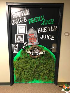 a door decorated to look like a beetlegy juice bottle with green moss growing out of it