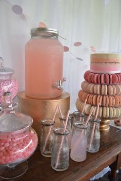 a table topped with lots of different types of candies and candy bar items on top of each other