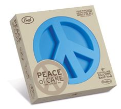 a blue peace sign cake pan in a cardboard box with the word peace on it