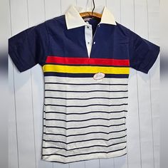 Perfect Condition Vintage Polo Shirt Kids Size 14 B3 Blue Polo T-shirt With Striped Collar, White Collared Shirt With Contrast Stripes, Cotton Color Block Collared Top, Casual Blue T-shirt With Striped Collar, White Color Block Collared Tops, White Collared Color Block Top, Blue Cotton Top With Contrast Stripes, Casual Multicolor Polo Shirt With Striped Collar, Blue Color Block Polo Shirt