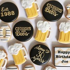 decorated cookies are arranged in the shape of beer mugs