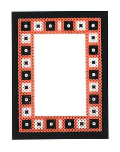 an orange and black frame with white dots on it, in the shape of a square