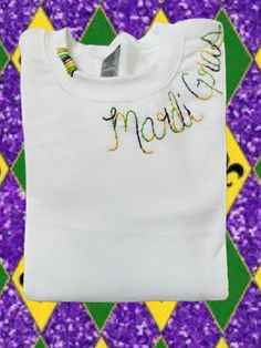 Hand embroidered multicolored thread embroidered Mardi Gras crewneck Diy Mardi Gras Shirt, Mardi Gras Embroidery, Mardi Gras Embroidery Designs, Spring Crew Neck Sweater With Embroidered Logo, Casual Multicolor Embroidered Sweater, Long Sleeve T-shirt With Multicolor Embroidery, Custom Embroidered Long Sleeve T-shirt, Multicolor Crew Neck Top With Embroidered Logo, Casual Crew Neck Sweater With Multicolor Embroidery