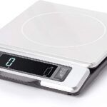 an electronic scale is shown with the time displayed on it's display screen,