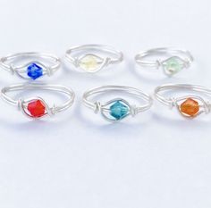 A simple yet beautiful handmade ring, made custom for you. Comes shipped in a beautiful gift box for an easy gift-giving experience Choose your color/ birthstone Not only is this ring is comfortable, lightweight and stylish, but it makes a great gift for a new mother (choose baby's birthstone color) , a bridesmaid gift, a best friend ring , Mother's ring etc. Tarnish Resistant Sterling Silver Plated Band Handmade with sterling silver plated wire band, the stones are synthetic but if you choose t Simple Nickel-free Wedding Jewelry, Adjustable Hypoallergenic Midi Rings For Wedding, Adjustable Birthstone Midi Rings For Wedding, Nickel Free Adjustable Stackable Wedding Rings, Personalized Adjustable Crystal Wedding Ring, Elegant Wire Wrapped Midi Rings As Gift, Adjustable Nickel-free Stackable Rings For Wedding, Elegant Wire Wrapped Midi Rings For Gift, Birthstone Midi Rings As Gifts