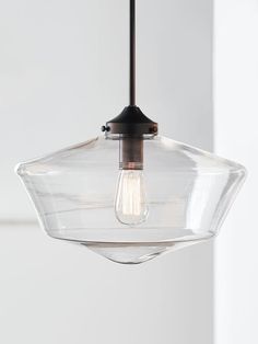 a clear glass light fixture hanging from a ceiling