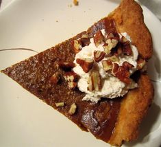 a slice of pecan pie topped with whipped cream