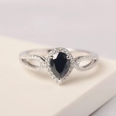 All HANDMADE ITEMS SHIP IN APPROX 8 DAYS Main Stone: Real natural black spinel Main Stone Size: Pear cut 5 mm x 7mm Main Stone Weight: 0.89carat Side Stone: CZs Height From The Ring Setting Bottom(to gemstone top): about 5.4 mm Width of Ring band Measure: gradually varied,about 2.04 to 4.39 mm Material: .925 Sterling Silver/14K White Gold/14K Yellow Gold/14k Rose Gold Engraved: Available For FreeNo more than 13 letters) Customized:Of course! Tell me what you want Includes With Order: All of my s Elegant Teardrop Sapphire Ring, Black Pear-shaped Ring For Anniversary, Elegant Teardrop Sapphire Ring Gift, Black Teardrop Wedding Rings, Black Teardrop Ring For Gift, Black Teardrop Rings For Gift, Blue Topaz Ring Silver, Black Spinel Ring, Spinel Ring