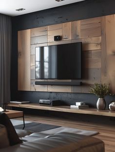 a living room with wooden paneling on the wall and a flat screen tv mounted above it