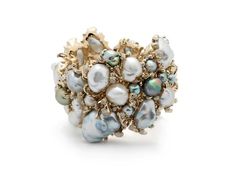 A cluster of Keshi pearls evokes gleaming, sun-flecked rocks in the Rock Pool Bracelet. This statement cuff is designed in 18k white gold, with its bold, organic shape conjuring the natural formation of rocks in the sea. White diamonds embellish the piece, while the pearls shimmer with iridescent tones of blue, white, Tones Of Blue, Jackson Hole Wyoming, Rock Pools, Keshi Pearls, Jackson Hole, Mother Pearl, White Diamonds, Organic Shapes, Cocktail Rings