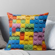 a multicolored lego block pattern throw pillow