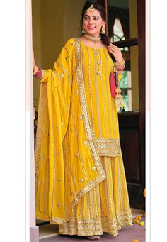 Faux Georgette Pakistani Suit in Yellow This Unstitched Attire with Poly Shantoon Lining is Highlighted with Zari and Gota Patti Work Available with a Faux Georgette Palazzo in Yellow and a Faux Georgette Dupatta in Mustard Do note: Accessories shown in the image are for presentation purpose only.(Slight variation in actual color vs. image is possible). Sharara Designs, Haldi Outfits, Indian Suit, Haldi Outfit, Function Dresses, Pakistani Suit, Palazzo Suit, Palazzo Set