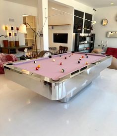 a pool table in the middle of a living room