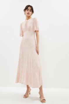 Style: A-Line DressDesign: PrintedFabric: SatinLength: MidiNeckline: CrewSleeve Length: Short Sleeve Floral Midi Dress With Sleeves, Viscose Midi Dress, Pastel Pink Dresses, Convocation Ideas, Angel Sleeve Dress, Open Back Midi Dress, Dresses Printed, Stylish Wedding Dresses, Christening Dress