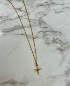 This beautiful Gold CZ Cross necklace is the perfect accessory to express your faith and add a touch of elegance to any outfit. Its intricate design and high-quality craftsmanship make it a must-have for any jewelry collection. Showcasing your Southern charm with style and grace has never been so effortless. 9'' long Gold Dipped Tiffany Gold, Gold Dipped, Southern Charm, Gold Cross, Style And Grace, Intricate Design, Cross Necklace, Jewelry Collection, High Quality