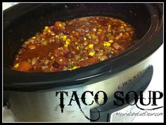 a crock pot filled with taco soup sitting on top of a stove