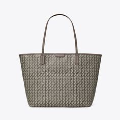 Ready for anything. A stylish tote that is supremely functional. Lightweight and durable in water-resistant coated canvas, our new Ever-Ready Tote has a secure zipped top and comes with a matching pouch. Slim straps are long enough to comfortably sit over the shoulder. Our iconic basketweave print is inspired by Tory's longtime fascination with basketry: Straw baskets in her Valley Forge home, woven bags found on travels, the caning of Parisian café chairs. The micro motif is both a statement an Tan Coated Canvas Bag With Zipper Closure, Tan Coated Canvas Bag With Zipper, Best Work Bag, Ella Tote, Woven Bags, Valley Forge, Parisian Cafe, Mediterranean Blue, Grey Tote