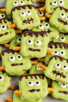 some green cookies with googly eyes and carrots