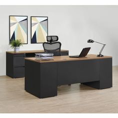 an office desk with a laptop on it and a chair in front of the desk