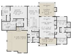 the first floor plan for a house with two master suites and an attached living area