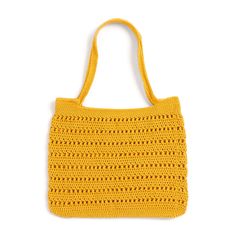 a yellow crocheted bag sitting on top of a white surface