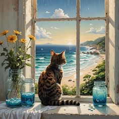 a cat is sitting on a window sill looking out at the ocean and beach